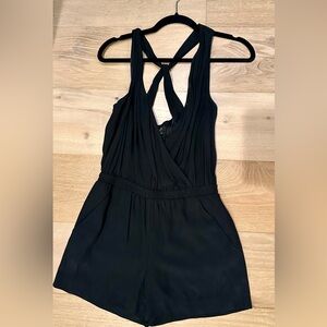 Loft xs petite black shorts romper with pockets in the front and back.
